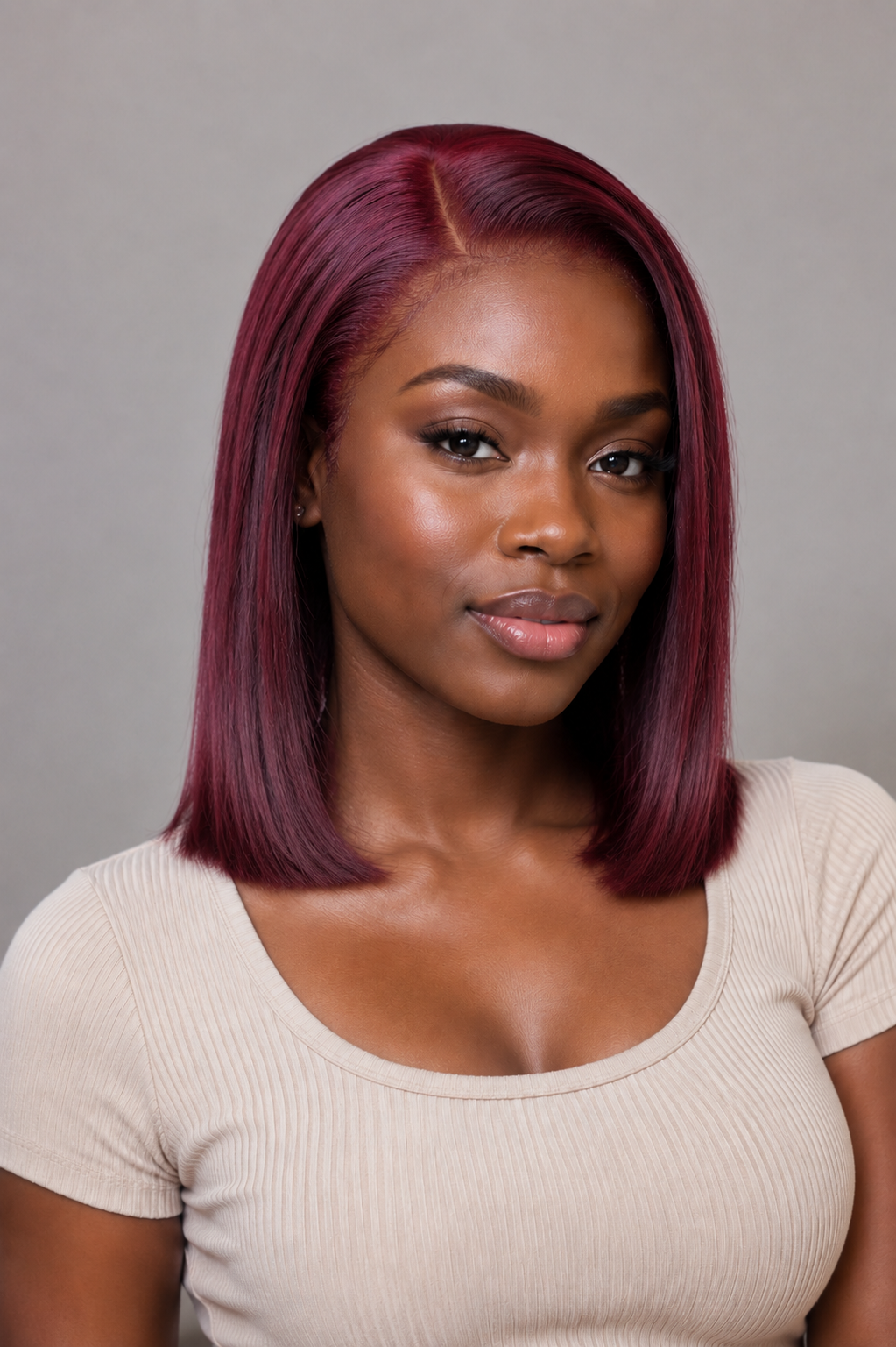 Model wearing a burgundy bob lace front wig